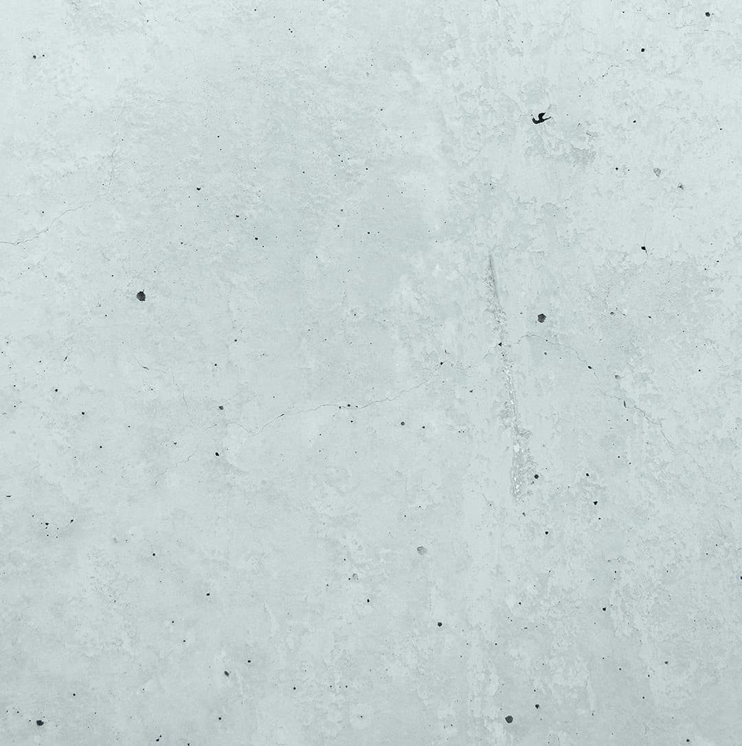 A textured grey concrete-like background resembling an industrial wall surface.